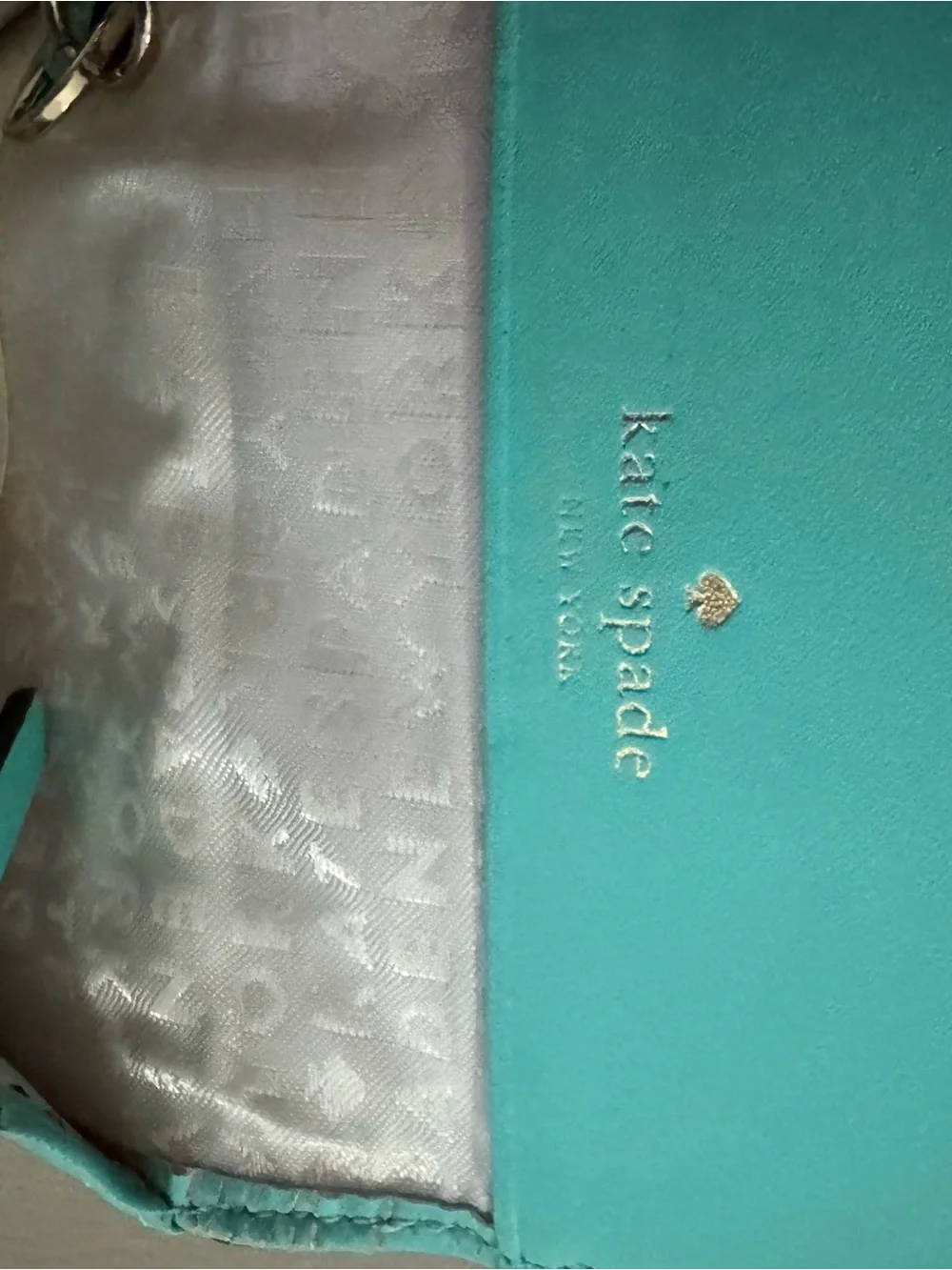 kate spade turquoise wristlet with gold logo